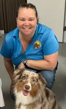 Christine S, Owner and Founder of Bauser's Pet Training, with an Australian shepherd